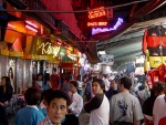 a local market with many t-shirts