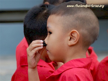 A Thai boy in school uniform.