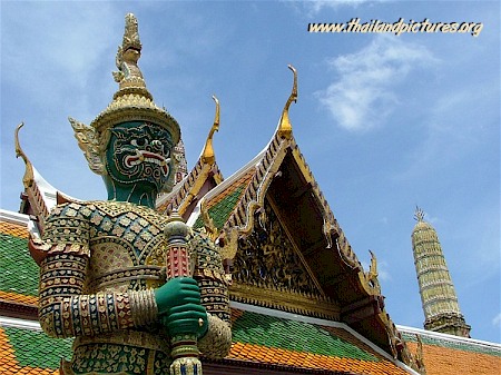 A guard statue in front of a temple.